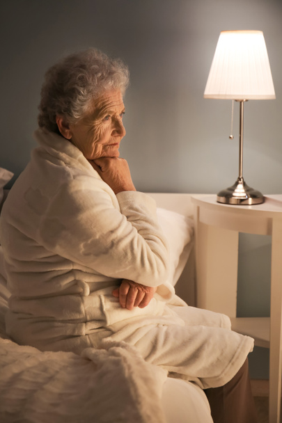 Senior woman suffering from insomnia at night - Photo, Image
