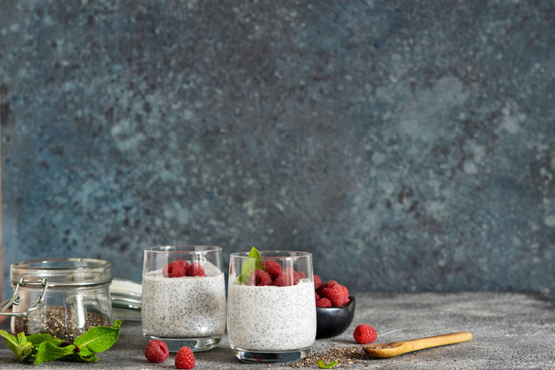 Chia pudding with yogurt and raspberries in a glass - Photo, Image