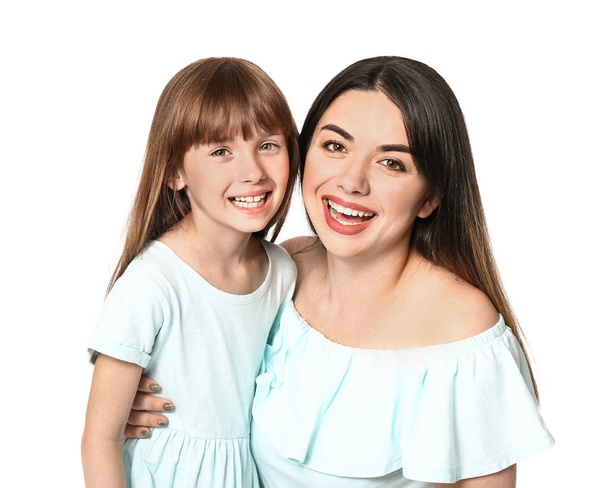 Portrait of happy mother and daughter on white background - Photo, Image