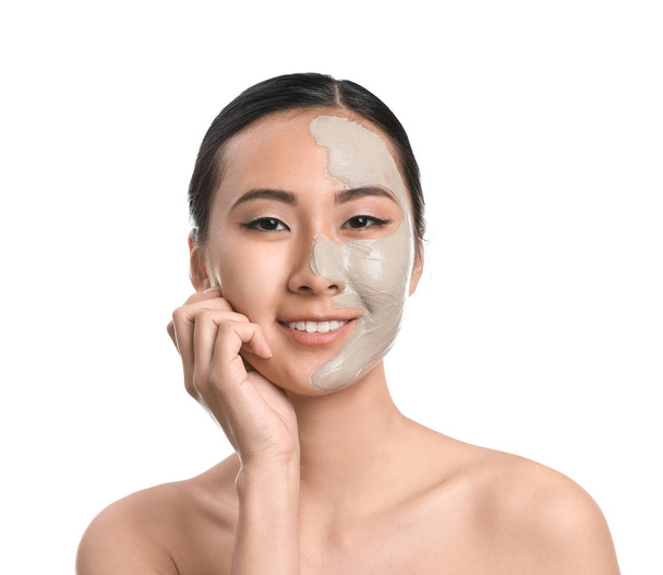 Beautiful Asian woman with facial mask on white background - Photo, Image