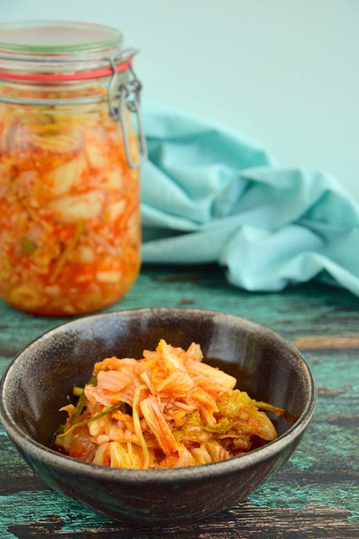 Kimchi, traditional Korean food, fermented Napa cabbage and radish with seasoning - 写真・画像