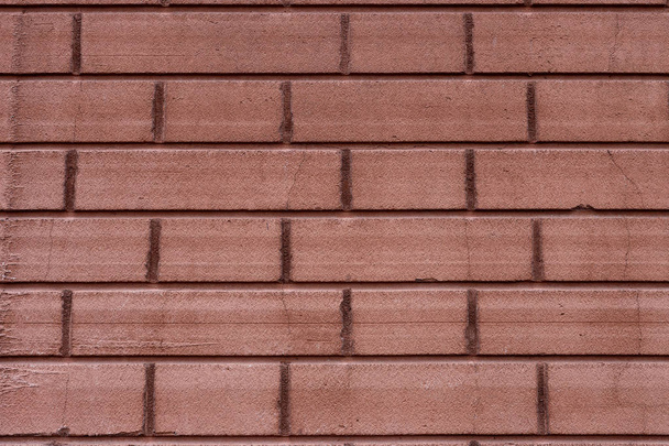 red brick wall with regular geometric structure close-up - Zdjęcie, obraz