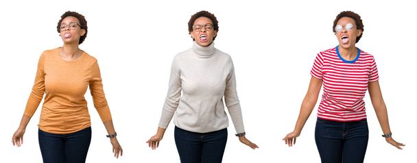 Afro saç ile genç Afrikalı Amerikan kadın gözlük komik ifade ile mutlu dil yapıştırma giyiyor. Duygu konsepti. - Fotoğraf, Görsel