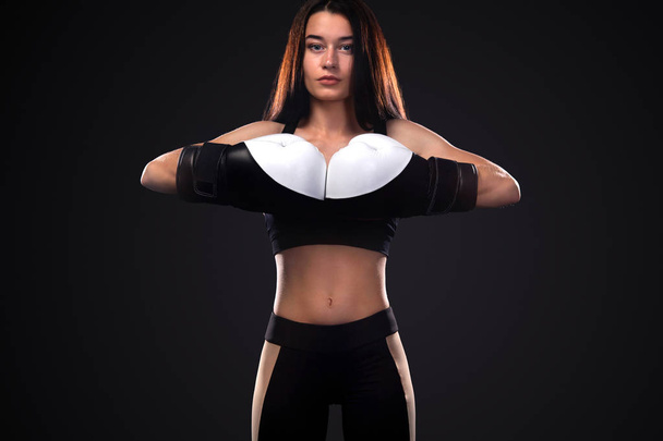 Woman boxer on black background. Boxing and fitness concept. - Fotó, kép