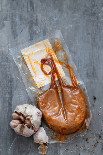 typical portuguese sausage Farinheira in plastic bag on ceramic  - 写真・画像