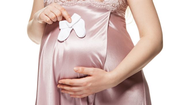 Primer plano del estómago de una mujer embarazada
 - Foto, Imagen