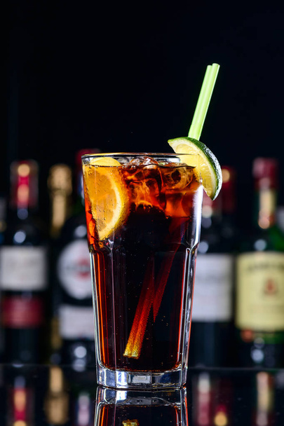 classic cocktail cuba libre with ice and close-up in a cuban bar - Fotoğraf, Görsel