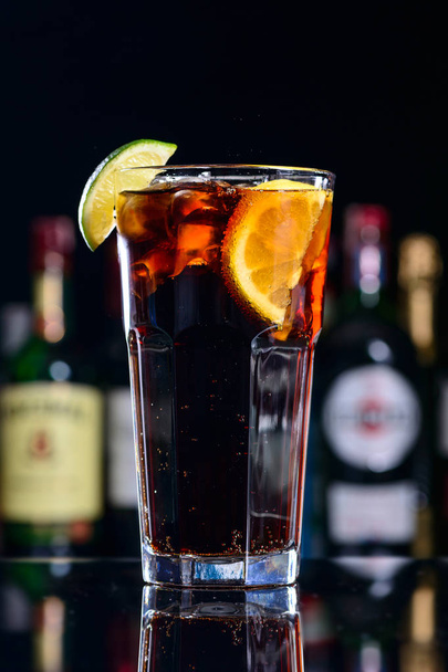 classic cocktail cuba libre with ice and close-up in a cuban bar - Foto, imagen