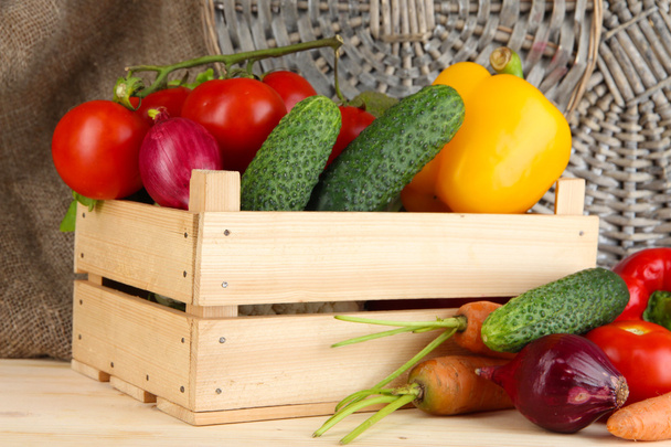 Fresh vegetables in box on wooden table close up - 写真・画像