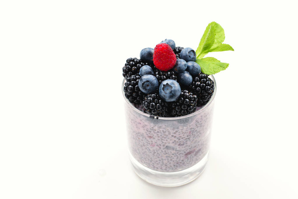 Chia pudding with mint, blueberry, blackberry on a white backgro - Zdjęcie, obraz