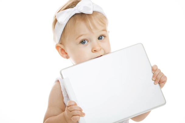 little girl all in white with a tablet - Zdjęcie, obraz