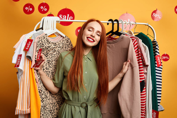 cheerful happy girl with closed eyes posing in the fitting room - Foto, Imagen