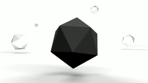 Siyah polihedron beyaz bir yüzey üzerinde genç ile döner. Bir küçük yüzeye kısmen batırılır. - Video, Çekim