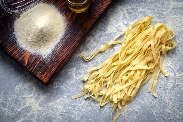 fresh pasta on the table - tagliatelle home made - Φωτογραφία, εικόνα
