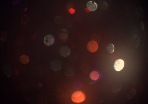 abstract background with defocused bokeh, glowing glitters wallpaper - Foto, imagen