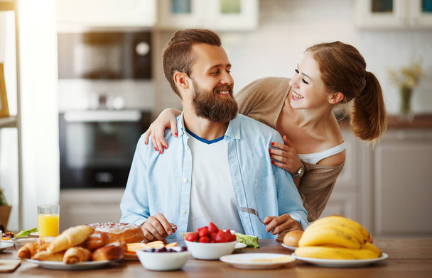 family happy couple have Breakfast in kitchen in morning - Foto, Imagem