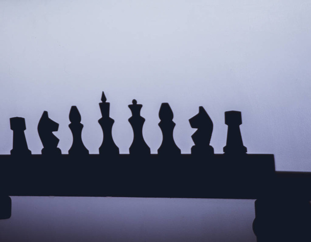 chess game, chess piece on the floor, chess silhouettes - Fotografie, Obrázek