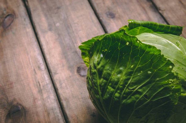 Fresh Cabbage on a wooden rustic table. Copy space. Healthy food - 写真・画像
