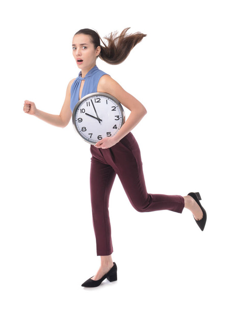 Correr joven mujer de negocios con reloj sobre fondo blanco
 - Foto, imagen