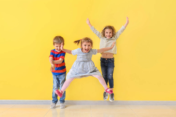 Cute little children having fun near color wall - Fotografie, Obrázek