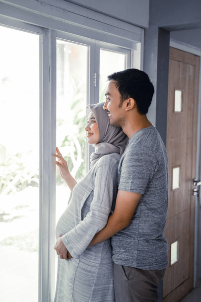 pregnant muslim wife leaning on romantic husband - Photo, Image