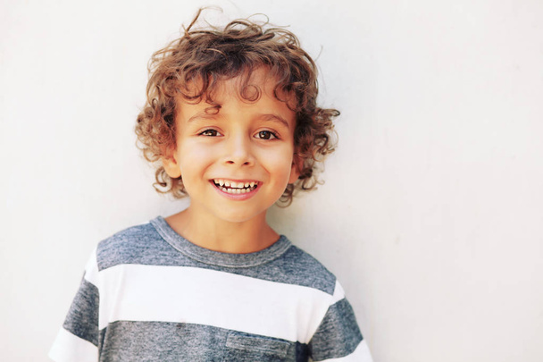 Funny little boy on white background - Fotó, kép