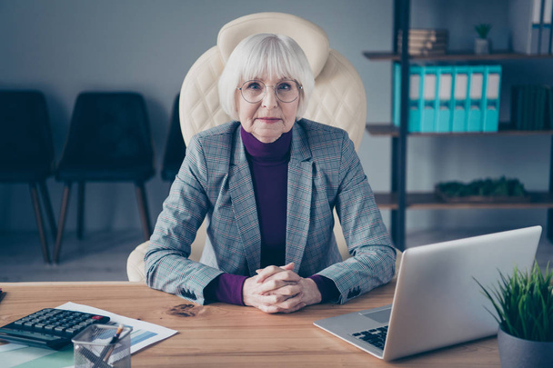 Closeup photo of aged business lady head organization corporation meet investors sit chair notebook table wear specs costume jacket - Photo, Image
