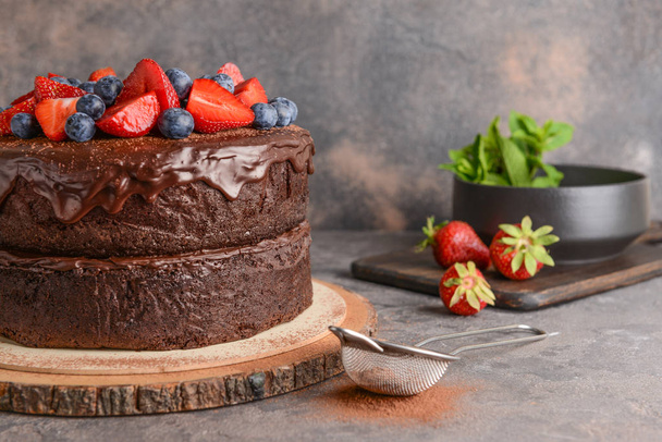 Tasty chocolate cake on grey table - Photo, Image