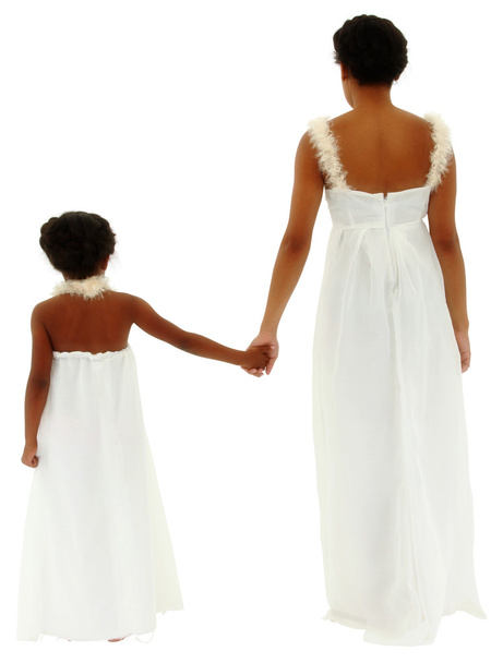Back side of mother daughter holding hands wearing white angel d - Foto, afbeelding