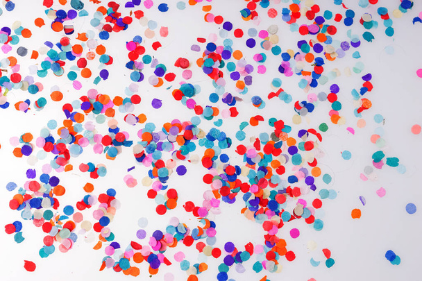 Colorful confetti on white background. Happy celebration party - Photo, Image