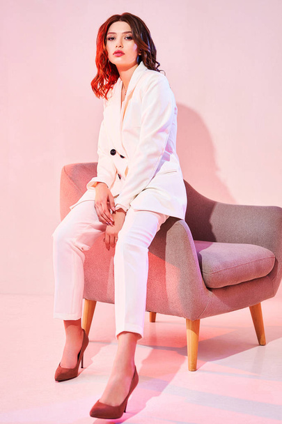 Young elegant woman in trendy white coat - Foto, Imagem