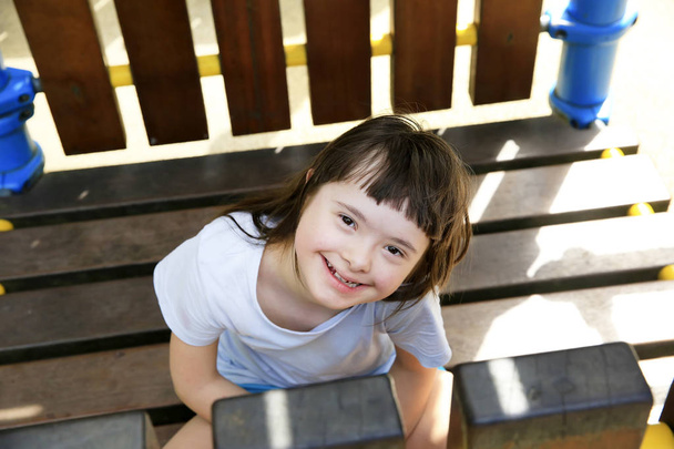 Portrait of little girl smiling in the park - Photo, Image