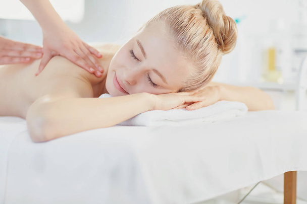 Woman getting massage in the spa salon. - Foto, immagini