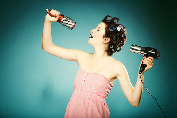 sexy girl in curlers with hairdryer styling hair - Fotografie, Obrázek