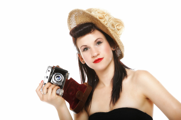 Pretty retro girl in hat with vintage camera - Фото, изображение