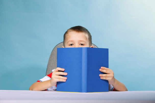 child boy kid reading a book on blue - Photo, Image