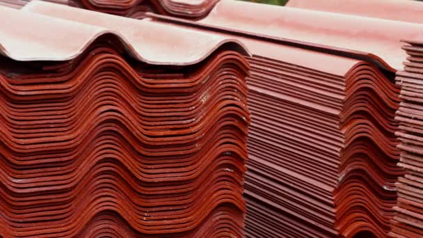 Stack red roof tiles, raw material for industrial of construction. Stock footage. Warehouse with red roof tiles - Footage, Video