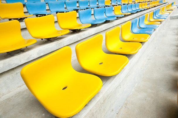 Yellow and Blue Seat on stadium - Zdjęcie, obraz