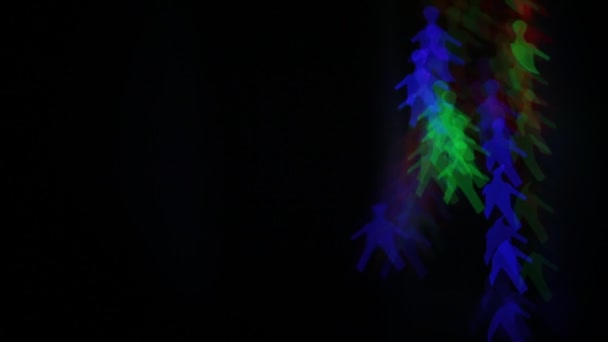 Erkeklerin yanıp sönen renkli rakamlar, alışılmadık parlak şekil ışıkları bir çelenk - Video, Çekim