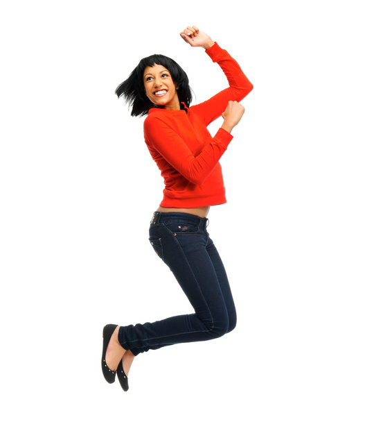 Excited woman jumps in joy - Фото, изображение