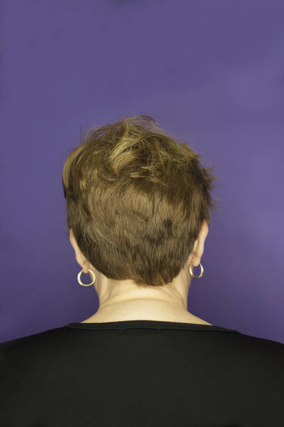 Middleaged woman with blond short hair - Фото, зображення