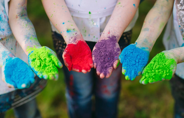Hands Palms of young people covered in purple, yellow, red, blue Holi festival colors isolated - Fotografie, Obrázek