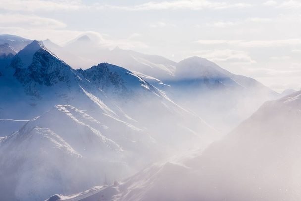 Daylight view of austrian mountains. Haze and sun - Photo, Image