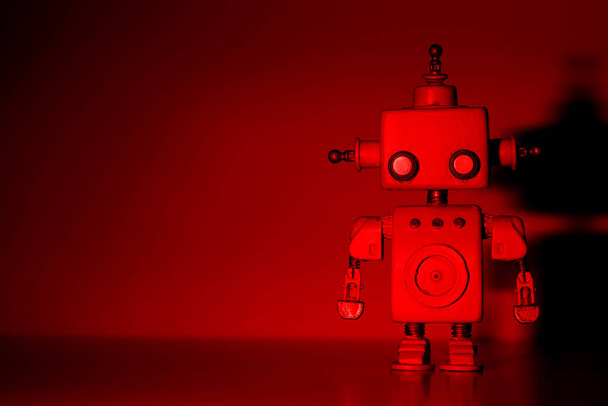 Robot on a red background. - Φωτογραφία, εικόνα