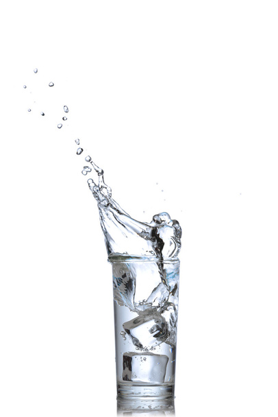 Glass of water with ice cubes on white background. - Foto, Bild