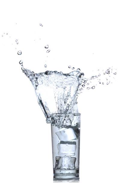 Water splashes in the glass on white background - Foto, afbeelding
