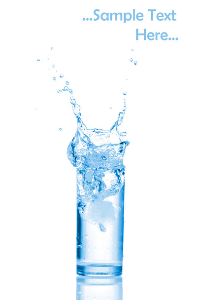 Glass of water with ice cubes on white background. - Φωτογραφία, εικόνα