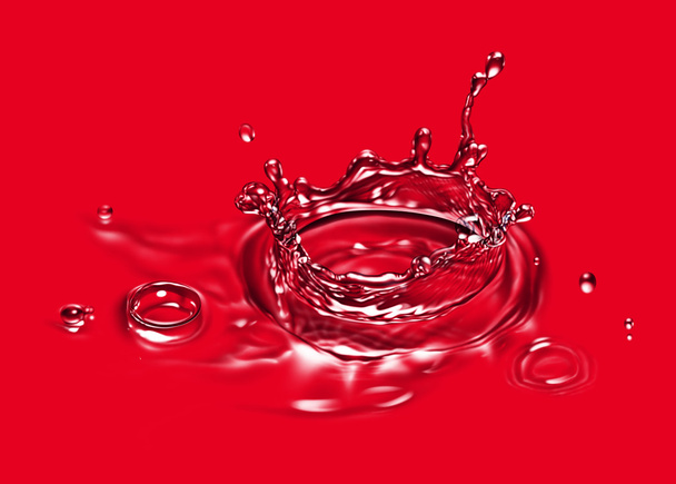 Water splash isolated on red - Photo, Image