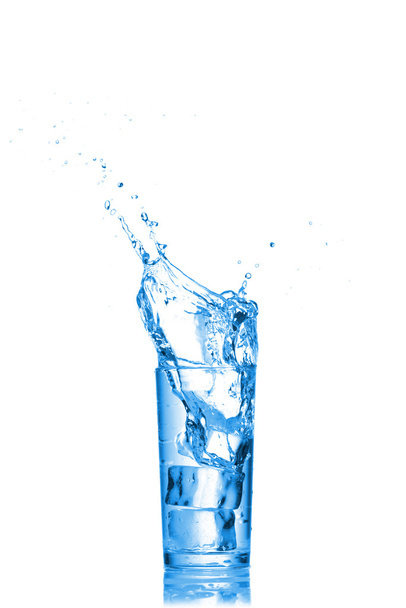 Water splashes in the glass on white background - Foto, Imagen
