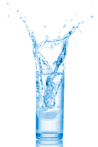 Glass of water with ice cubes on white background. - Valokuva, kuva